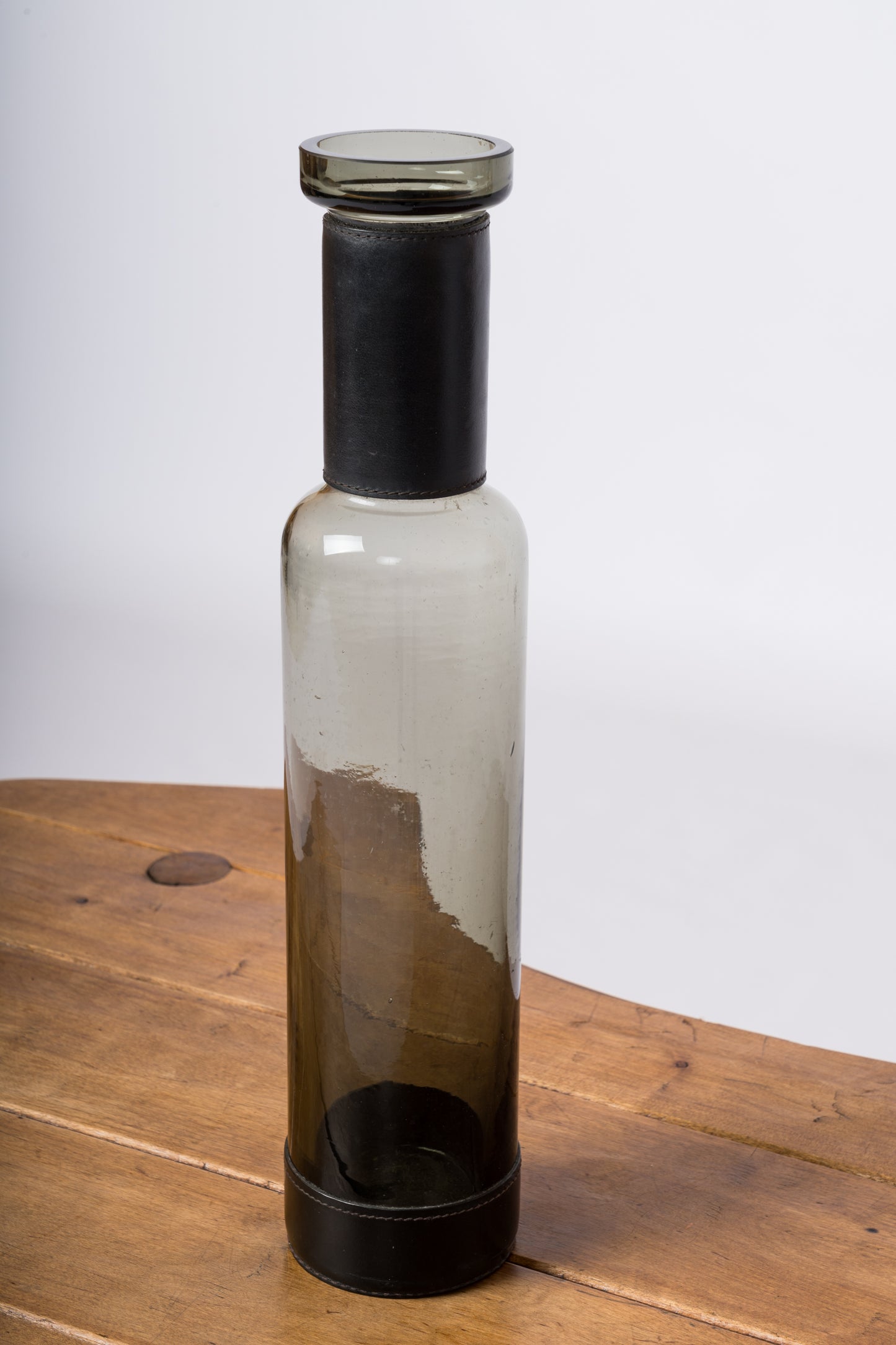 Smoked Black Glass & "Piqué Sellier" Stitched Leather Bottle - England 1960's