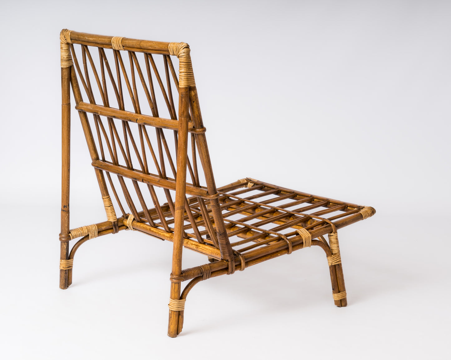Single Rattan Mid Century Lounger in the style of Audoux Minnet - France 1960's