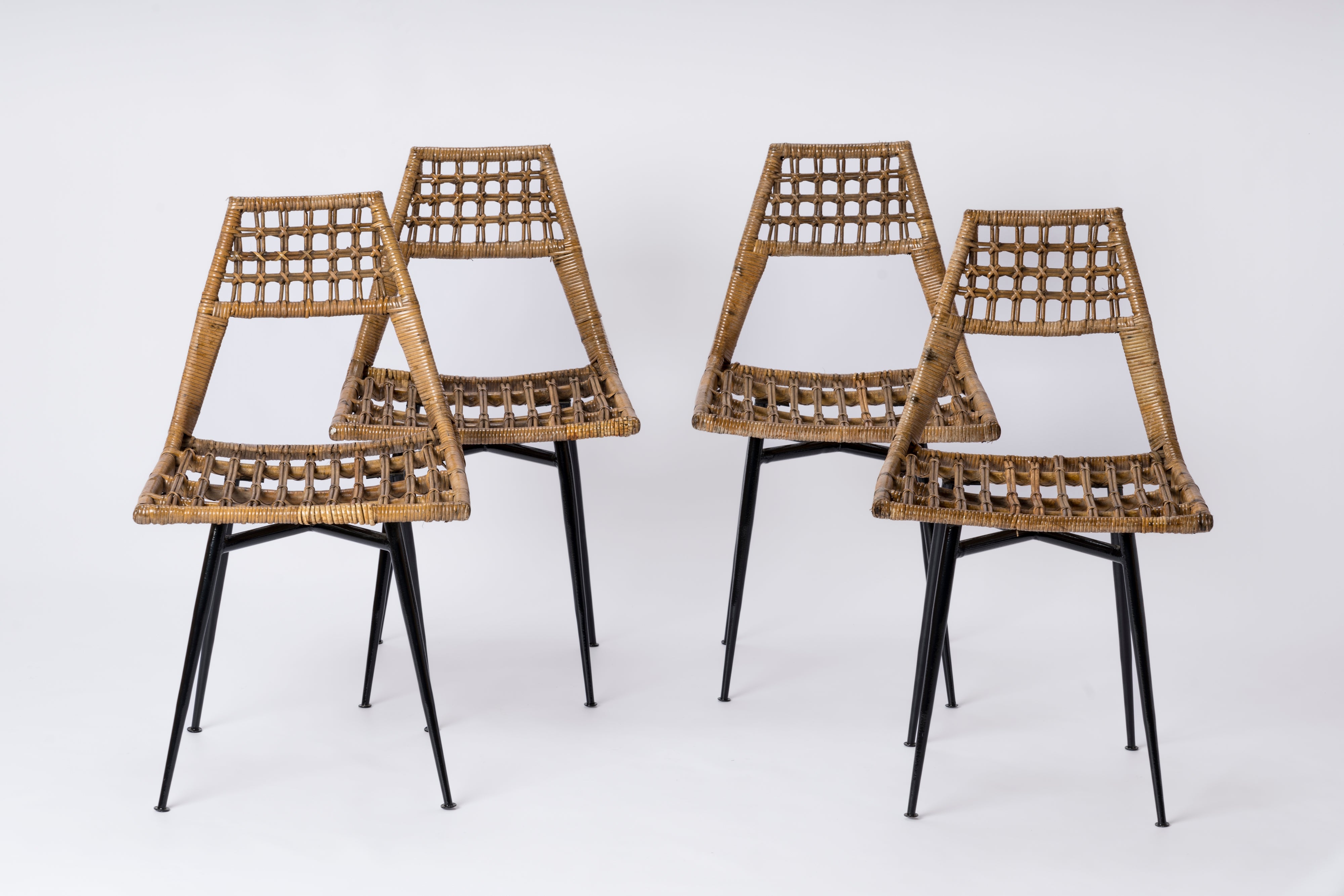 Set of four Rattan Basket Chairs by Lucien Carrier