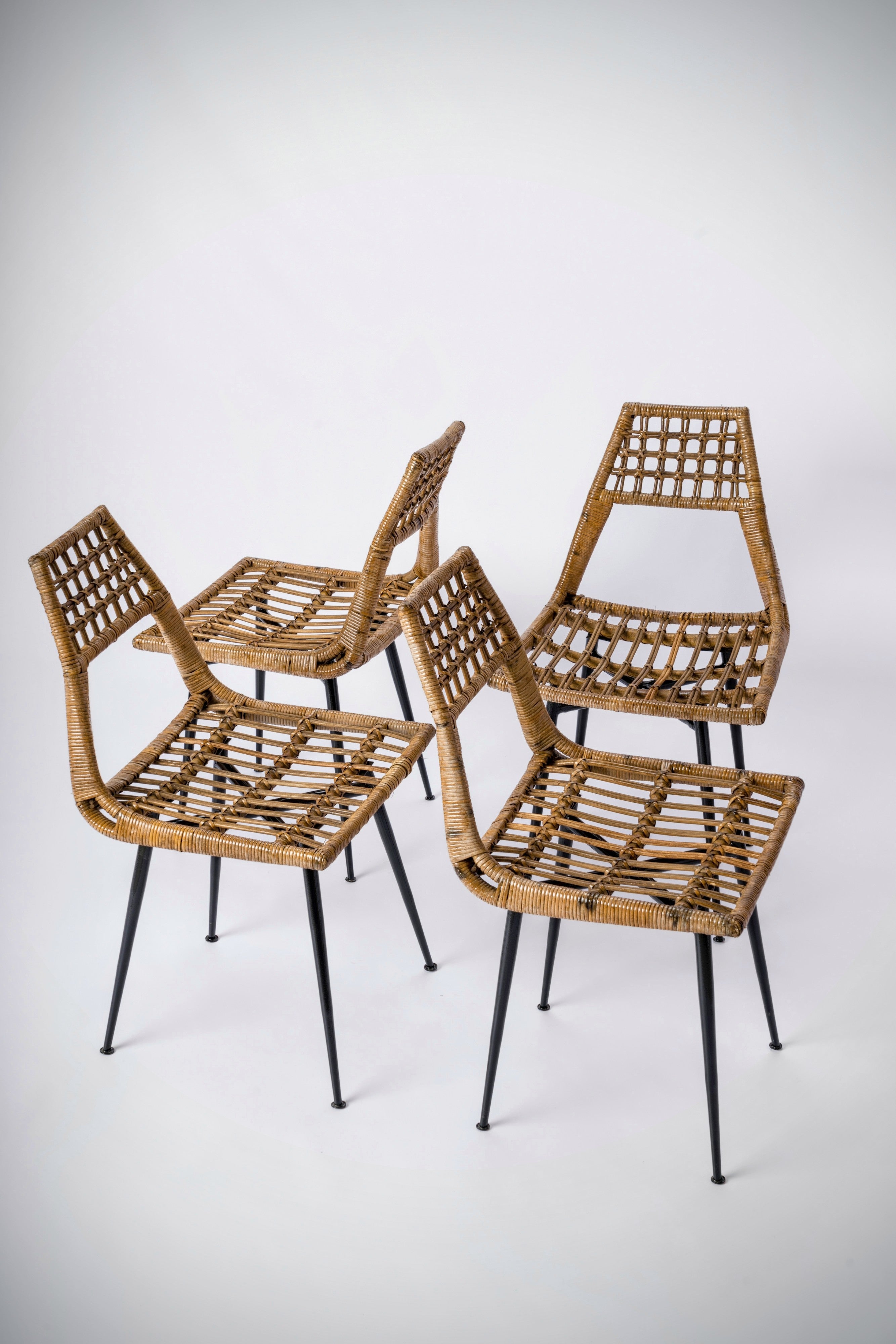 Set of four Rattan Basket Chairs by Lucien Carrier