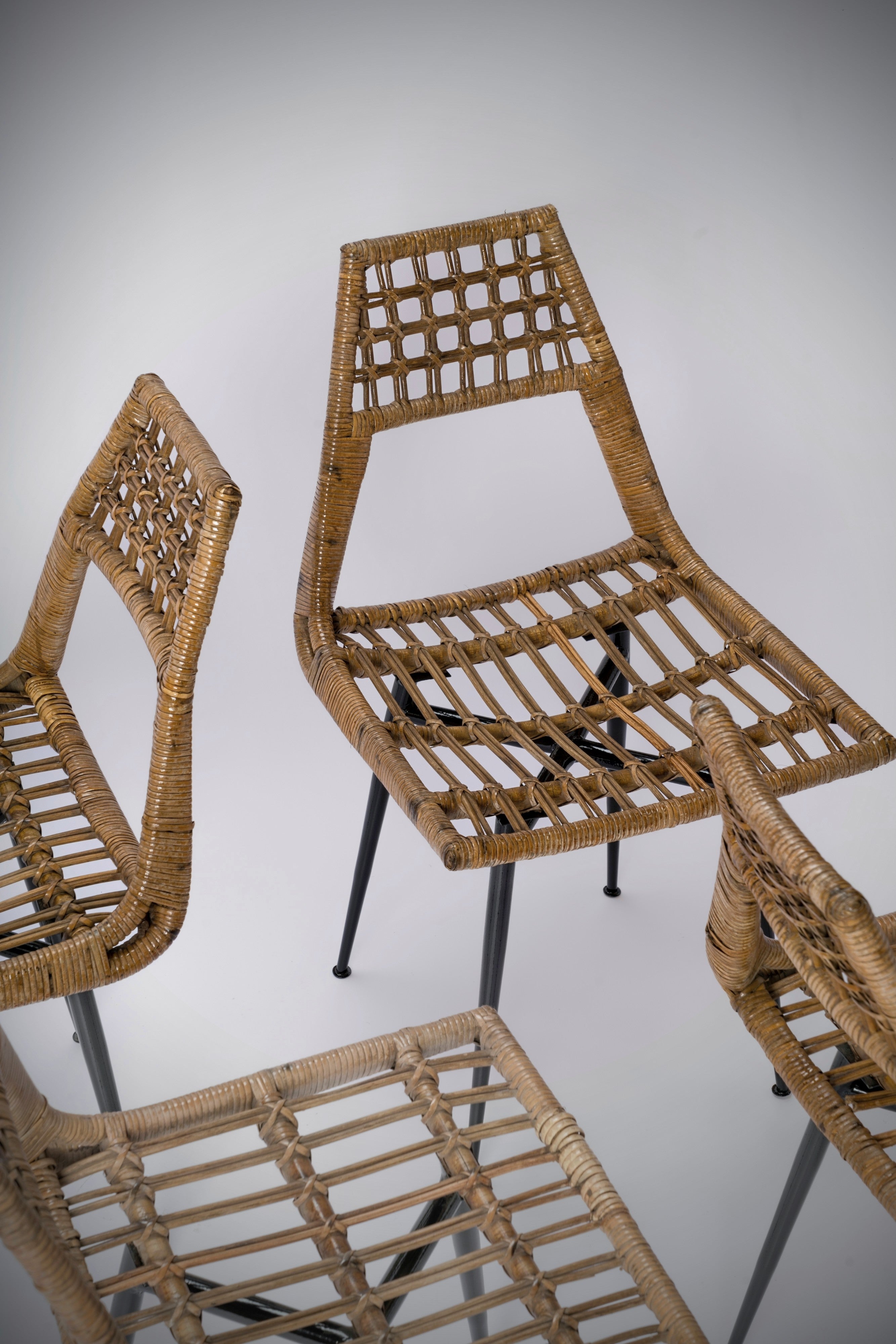 Set of four Rattan Basket Chairs by Lucien Carrier