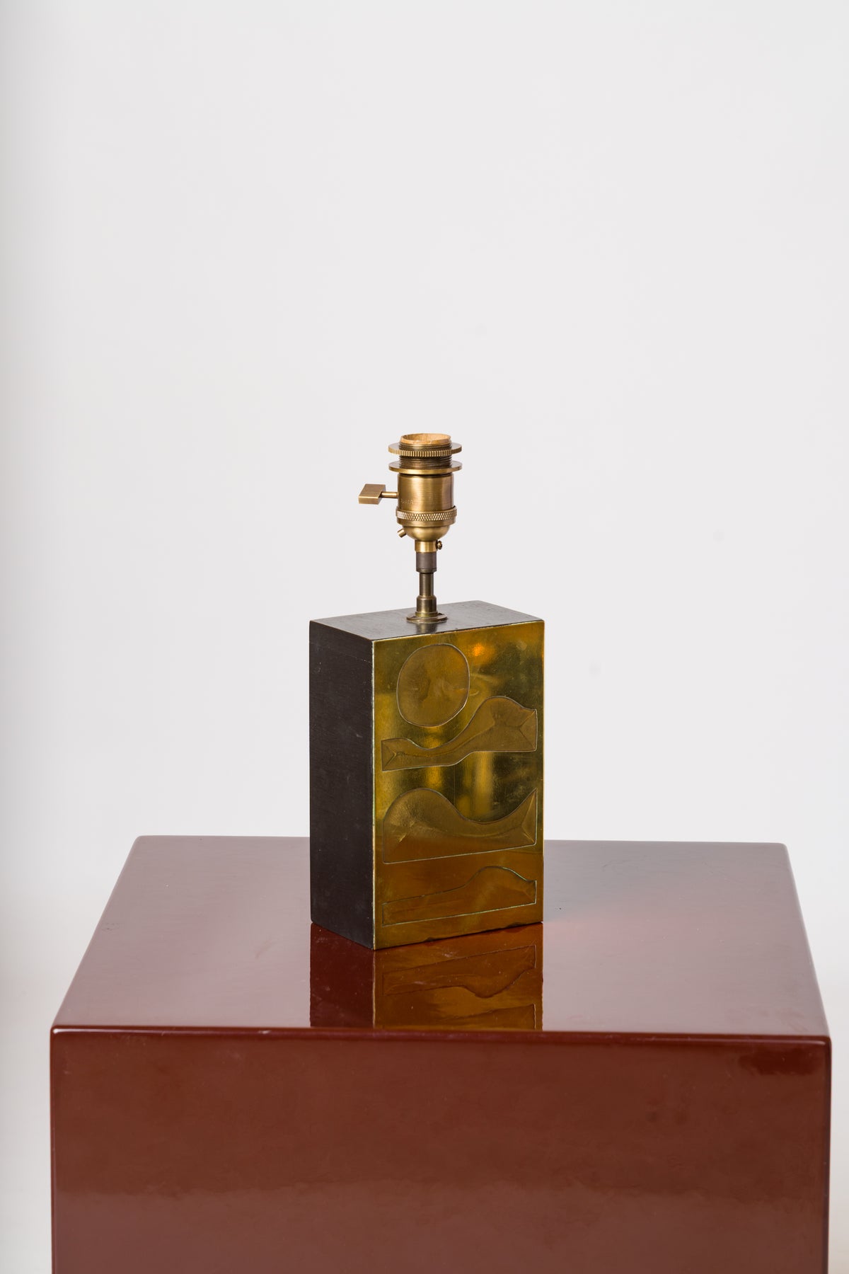 Engraved Brass Panel over Bois Noirci Table Lamp by Jean Blazy - France 1970's