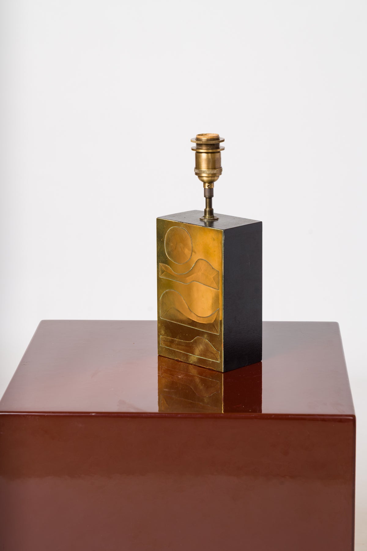 Engraved Brass Panel over Bois Noirci Table Lamp by Jean Blazy - France 1970's
