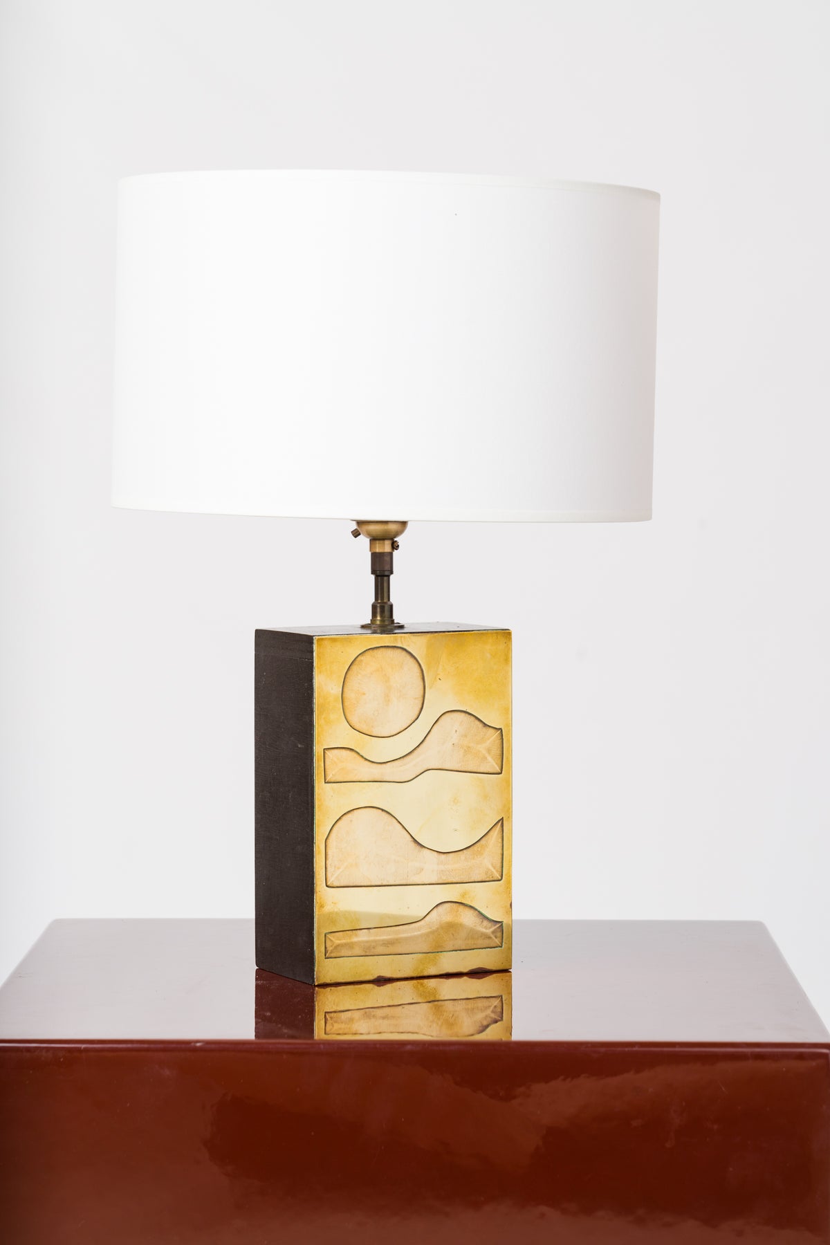 Engraved Brass Panel over Bois Noirci Table Lamp by Jean Blazy - France 1970's