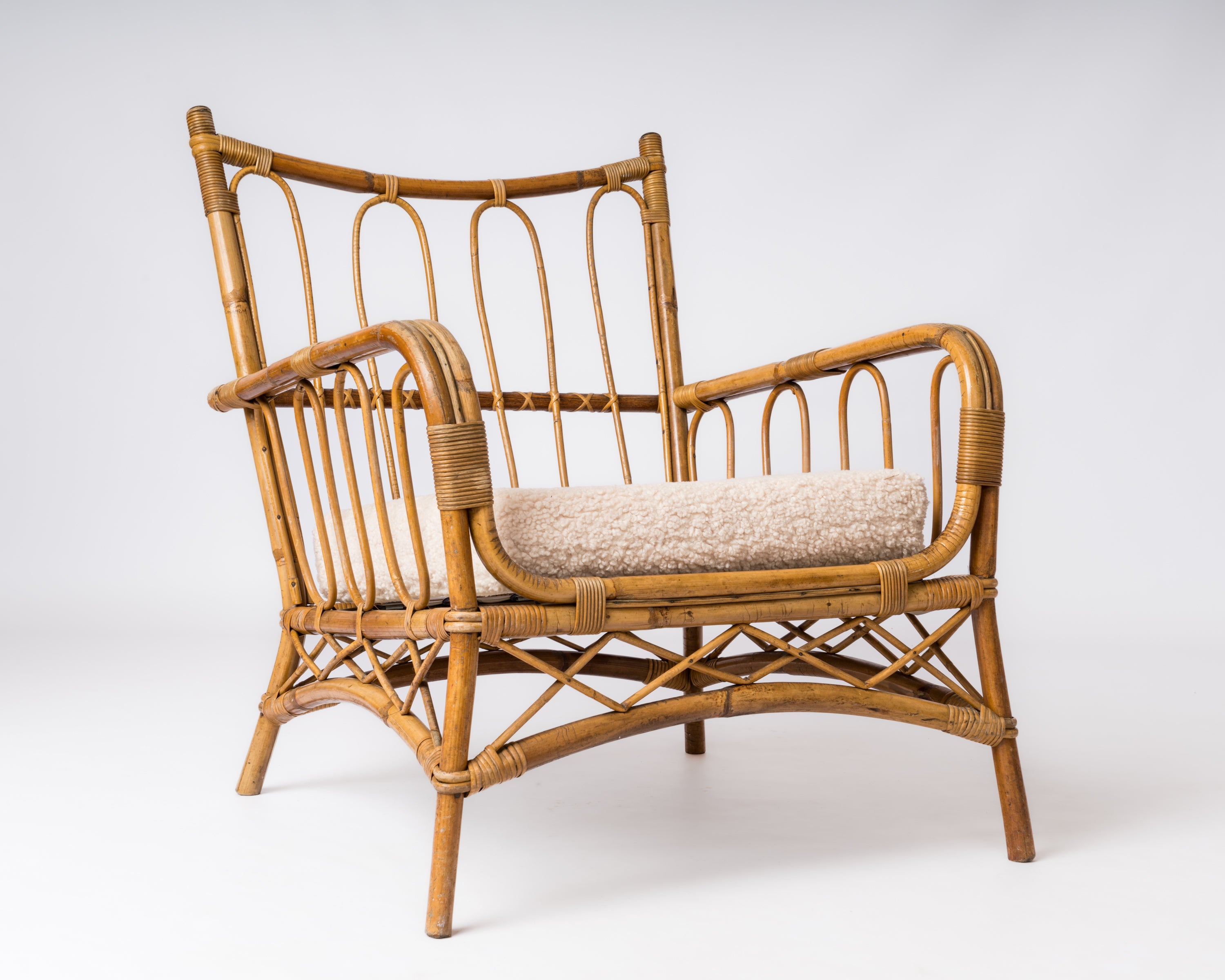 Single Rattan Armchair in the style of Louis Sognot - France 1960's