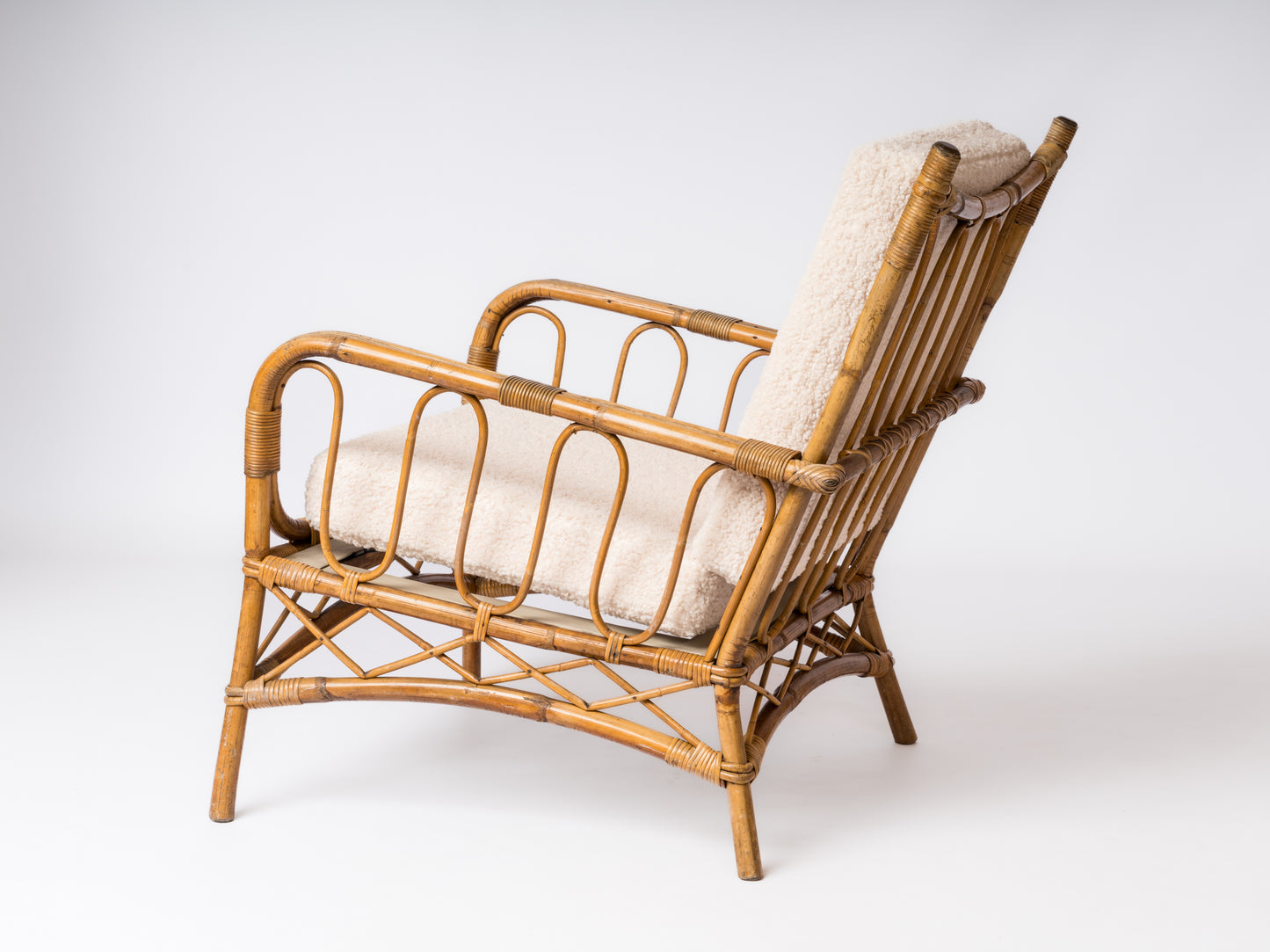 Single Rattan Armchair in the style of Louis Sognot - France 1960's